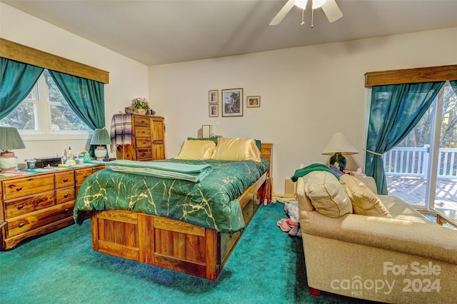 carpeted bedroom featuring multiple windows, access to outside, and ceiling fan