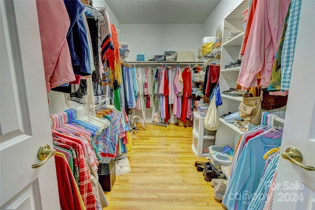 spacious closet featuring hardwood / wood-style floors