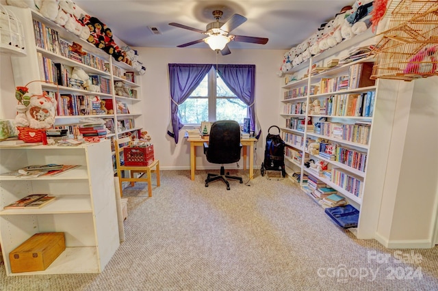 office space featuring ceiling fan and light carpet