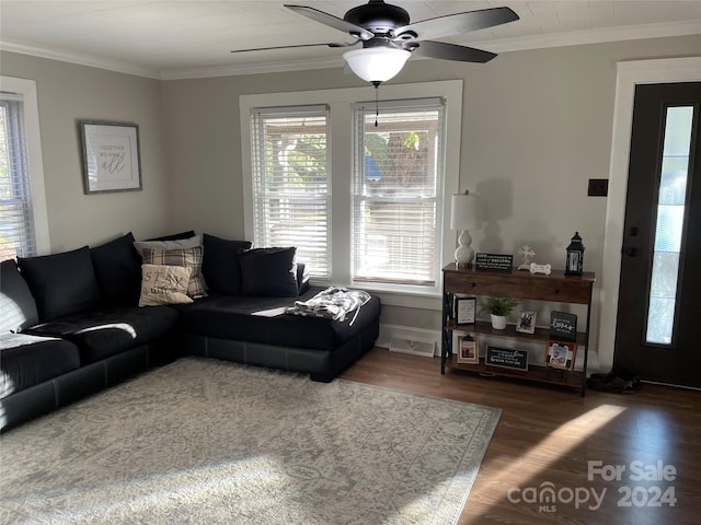 living room featuring ceiling fan, dark hardwood / wood-style flooring, and ornamental molding