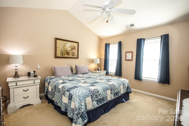 bedroom featuring ceiling fan, light colored carpet, and vaulted ceiling