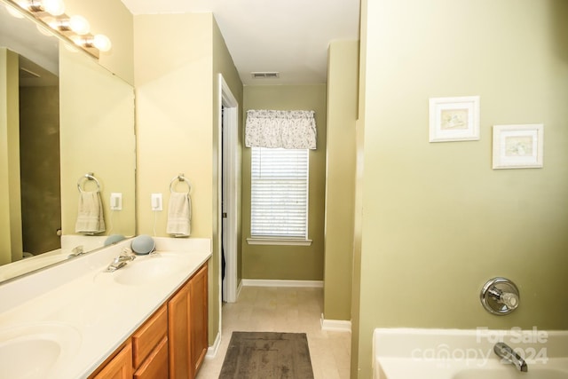 bathroom with vanity and a tub to relax in