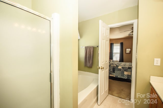 bathroom featuring vanity and plus walk in shower