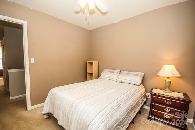 bedroom featuring ceiling fan and light colored carpet