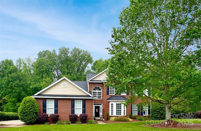 9618 Belloak Ln, Waxhaw, NC 28173 - view of front facade with brick siding and a front lawn