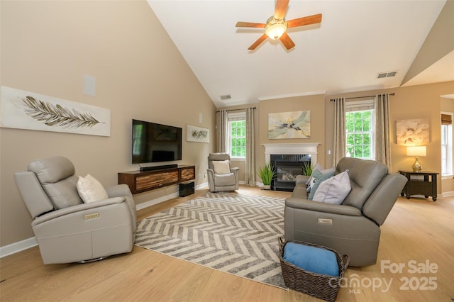 9618 Belloak Ln, Waxhaw, NC 28173 - living room with a high end fireplace, light wood-style flooring, ceiling fan, plenty of natural light, and high vaulted ceiling