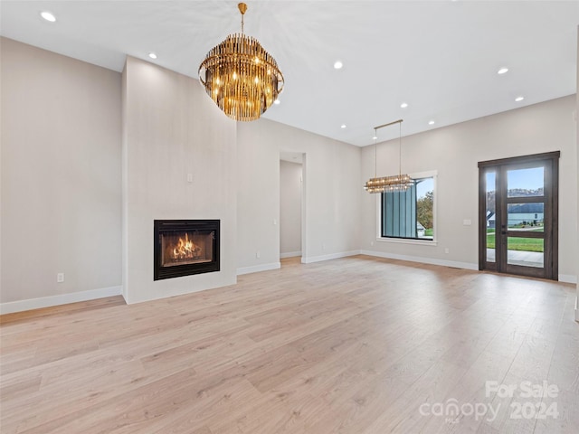 unfurnished living room with light hardwood / wood-style flooring