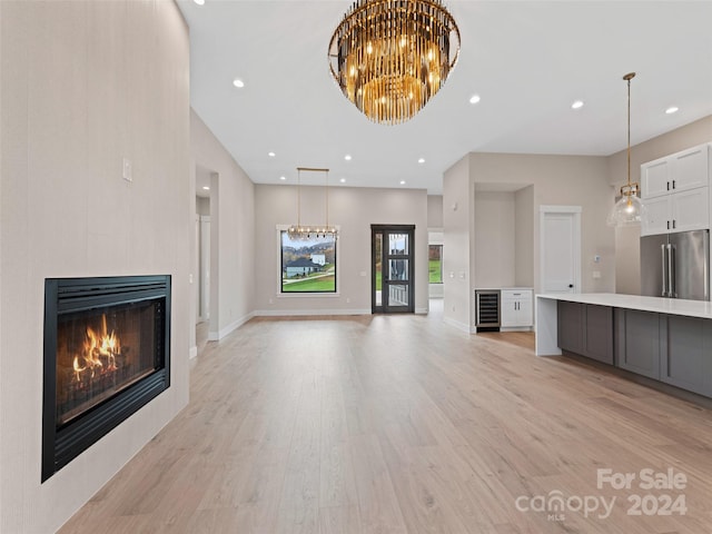 unfurnished living room with light hardwood / wood-style floors and a tiled fireplace