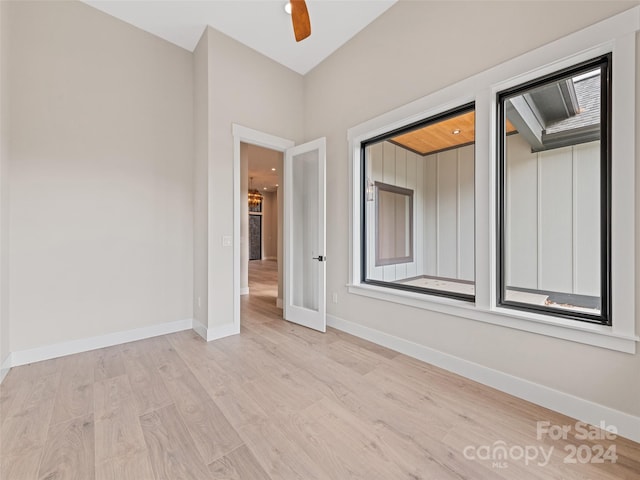 unfurnished room with ceiling fan and light hardwood / wood-style flooring