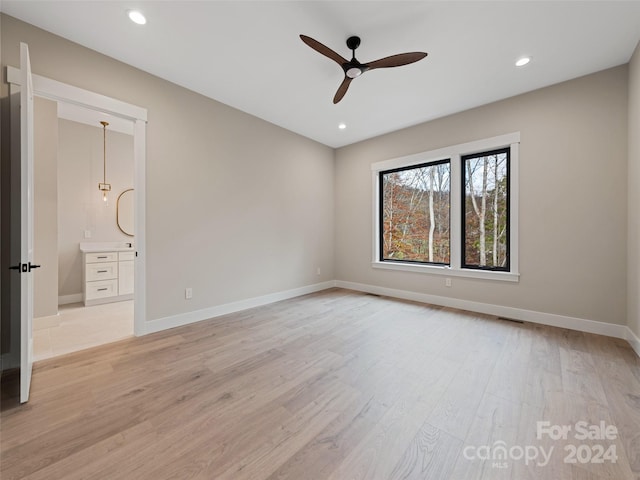 unfurnished room with ceiling fan and light hardwood / wood-style floors