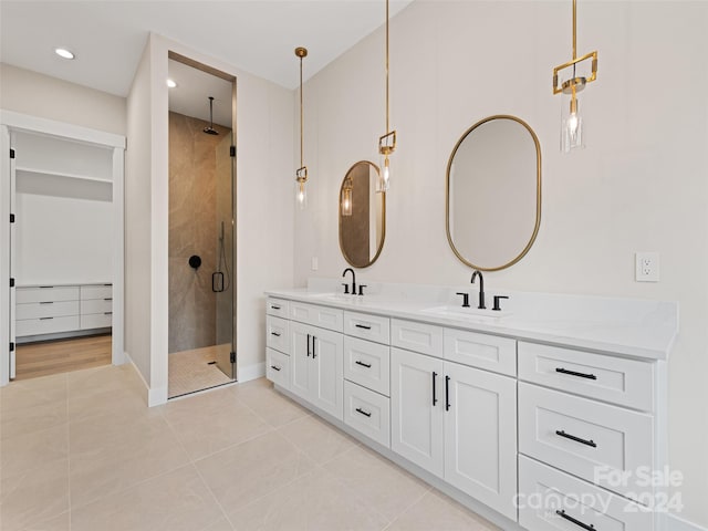 bathroom with vanity, tile patterned floors, and an enclosed shower