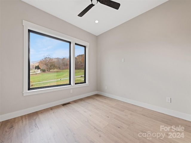 unfurnished room with ceiling fan and light hardwood / wood-style floors