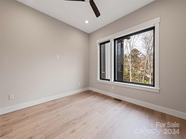 spare room featuring ceiling fan and light hardwood / wood-style floors