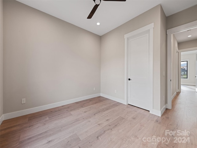 unfurnished room featuring ceiling fan and light wood-type flooring