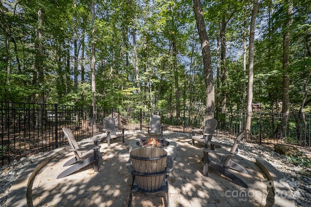 view of patio / terrace with an outdoor fire pit