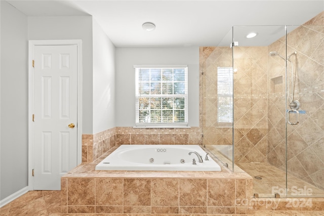 bathroom with shower with separate bathtub