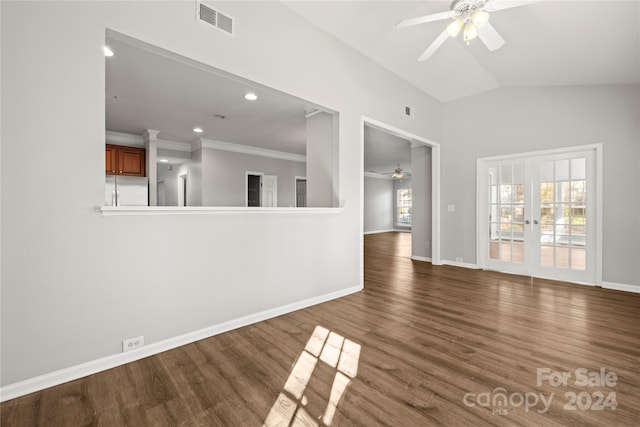 unfurnished living room featuring lofted ceiling, french doors, dark hardwood / wood-style floors, ceiling fan, and ornamental molding