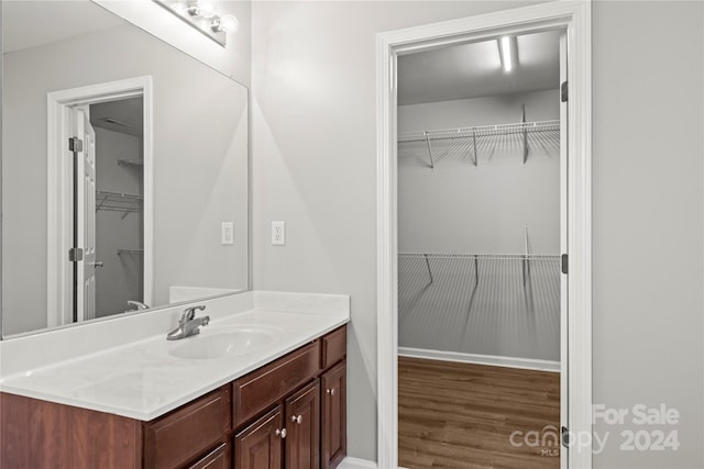 bathroom featuring hardwood / wood-style floors and vanity