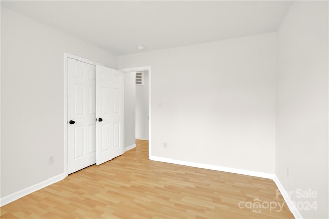 unfurnished bedroom featuring light wood-type flooring