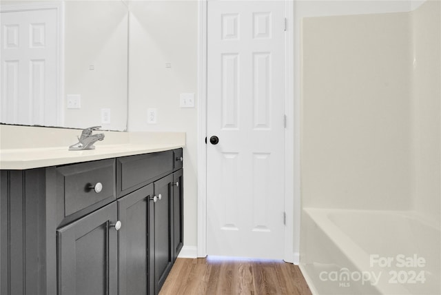 bathroom featuring vanity and wood-type flooring