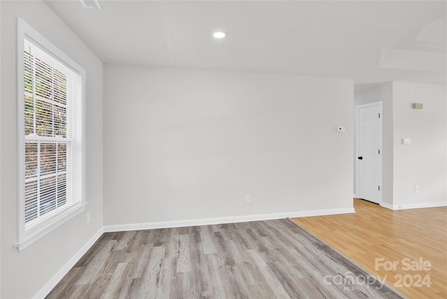 spare room with light wood-type flooring