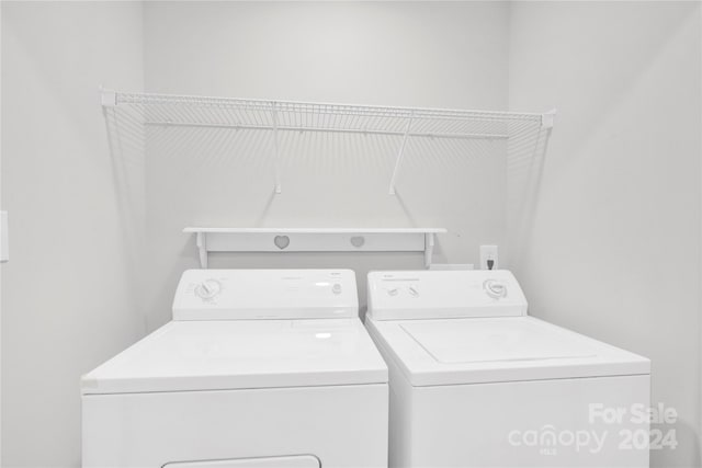 laundry room with separate washer and dryer