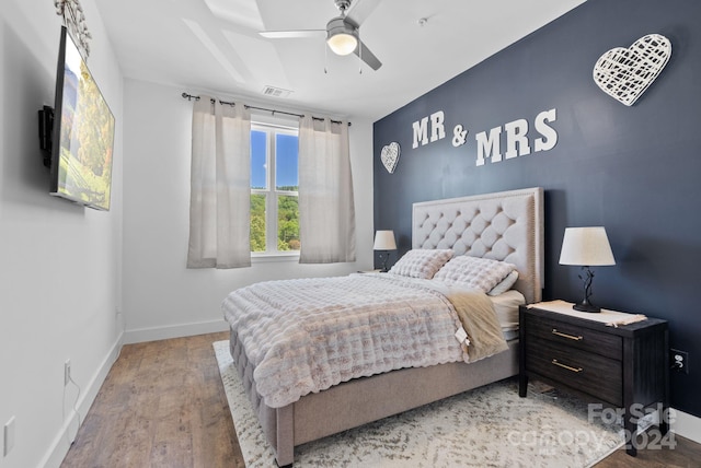 bedroom featuring light wood-type flooring and ceiling fan