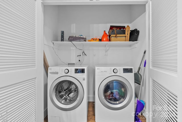 clothes washing area featuring independent washer and dryer