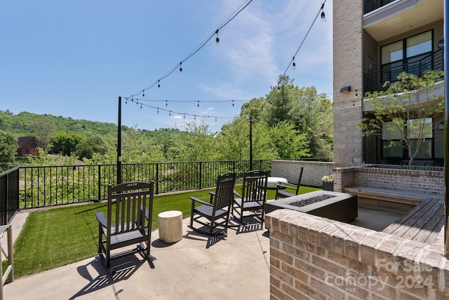 view of patio / terrace with a fire pit