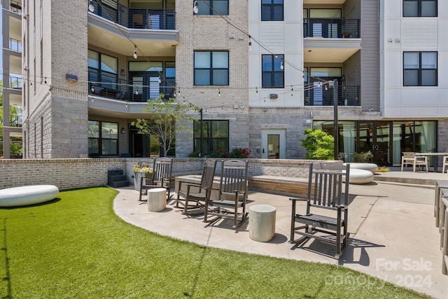 view of home's community featuring a patio area