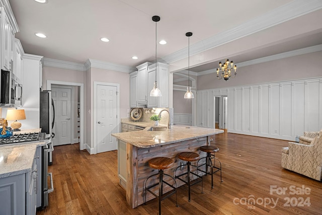 kitchen with light stone countertops, sink, stainless steel appliances, dark hardwood / wood-style floors, and white cabinets