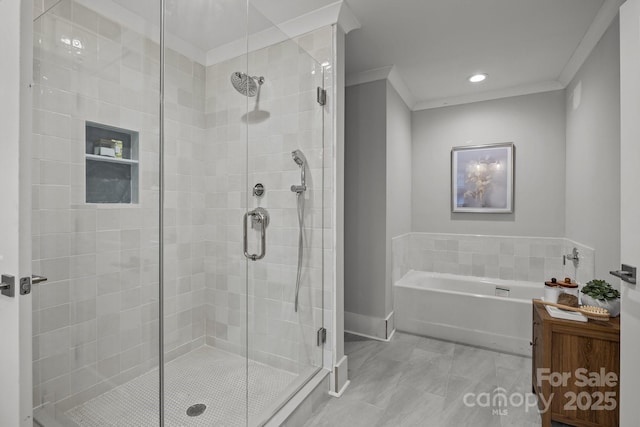 bathroom featuring ornamental molding and independent shower and bath