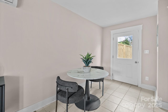 foyer entrance featuring a wall mounted air conditioner and light tile patterned floors