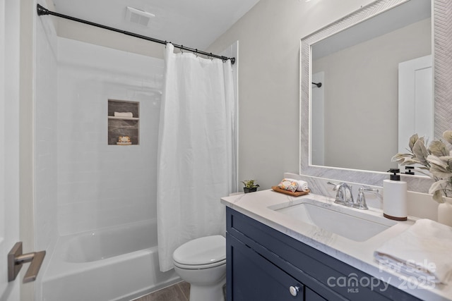 full bathroom with toilet, vanity, and shower / bathtub combination with curtain