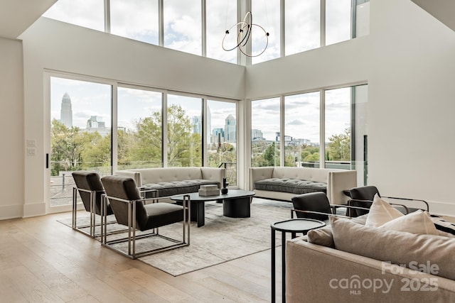 interior space with an inviting chandelier and light hardwood / wood-style floors