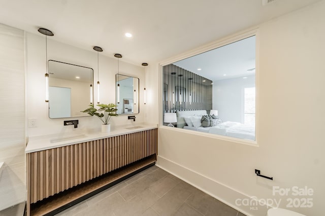 bathroom with vanity and tile patterned floors