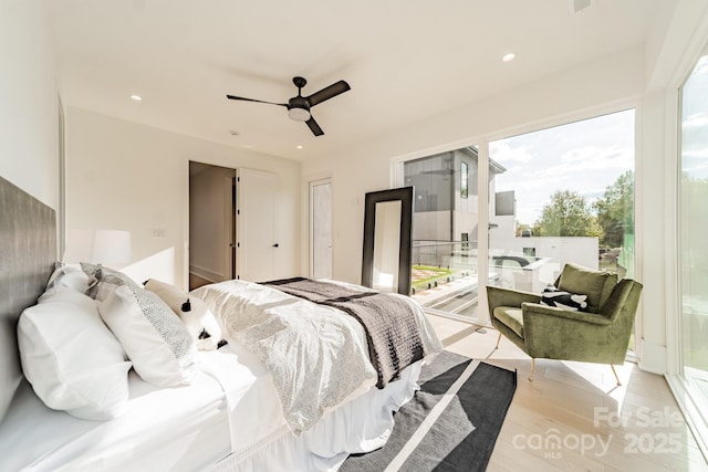 bedroom with ceiling fan, access to outside, and light hardwood / wood-style floors