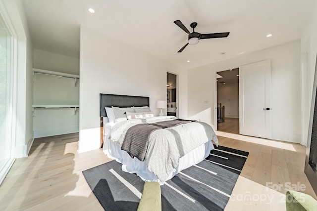 bedroom featuring ceiling fan and light hardwood / wood-style floors