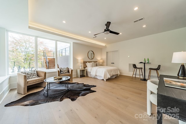 bedroom featuring ceiling fan and light wood-type flooring