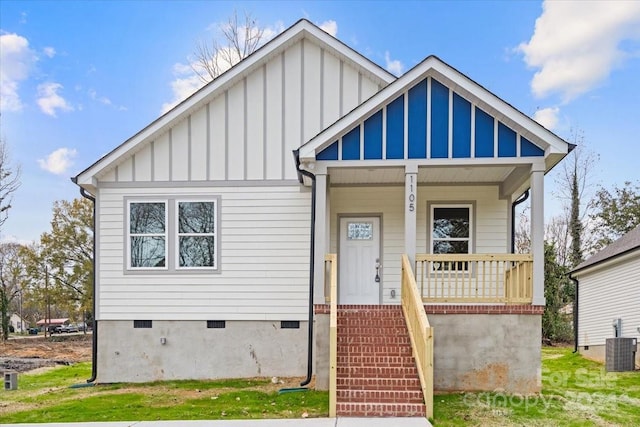 view of front of home with central air condition unit and a porch