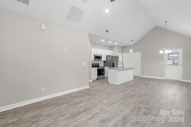 unfurnished living room featuring an inviting chandelier, sink, high vaulted ceiling, and light hardwood / wood-style flooring