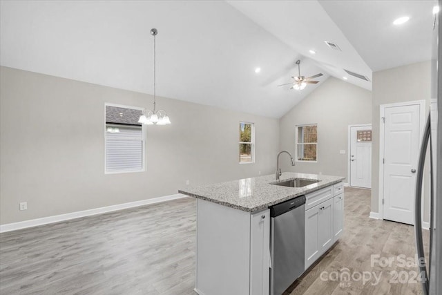 kitchen featuring appliances with stainless steel finishes, light hardwood / wood-style flooring, hanging light fixtures, and sink