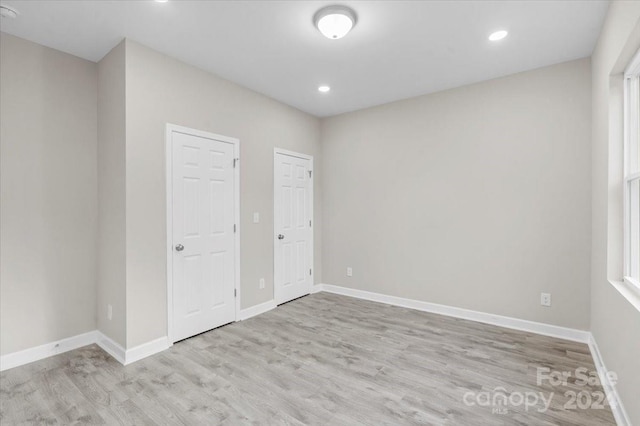 unfurnished bedroom with light hardwood / wood-style flooring