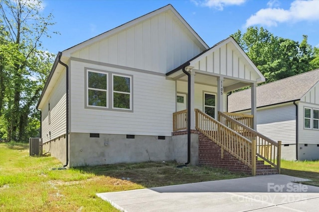 1105 Kenly St, Salisbury, NC 28144 - view of front of home with board and batten siding, crawl space, and cooling unit