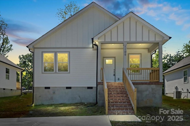 1105 Kenly St, Salisbury, NC 28144 - bungalow-style home featuring central AC, board and batten siding, stairway, crawl space, and covered porch