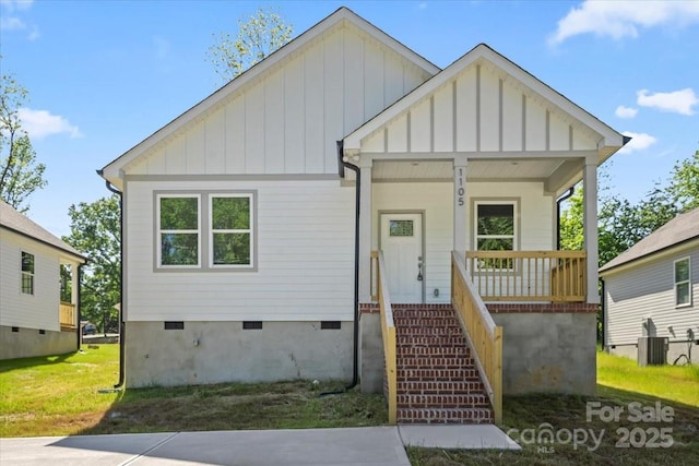 1105 Kenly St, Salisbury, NC 28144 - bungalow featuring board and batten siding, crawl space, cooling unit, and a porch