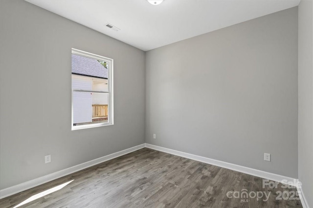 1105 Kenly St, Salisbury, NC 28144 - spare room featuring baseboards, wood finished floors, and visible vents