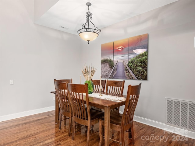 dining space with hardwood / wood-style flooring