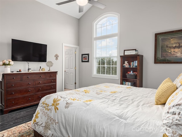 bedroom featuring vaulted ceiling, ceiling fan, and dark hardwood / wood-style flooring