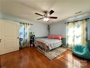 bedroom featuring hardwood / wood-style flooring and ceiling fan